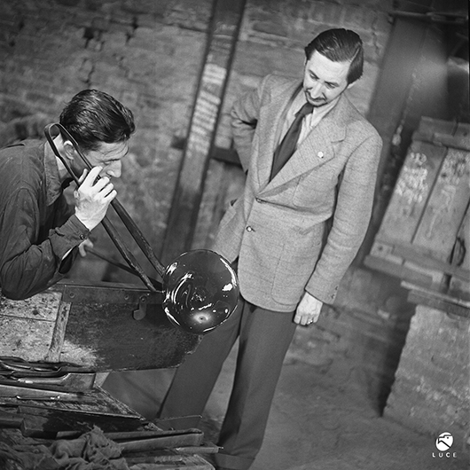 From 1932 to 1947, Carlo Scarpa (1906-1978) served as artistic director at the Venini Glassworks, where he developed innovative techniques that reinvigorated Venetian glassmaking. Scarpa (right) is shown with glassmaker Arturo Biasutto at the factory in an archival photo from 1943. Archivio Storico Luce. Photo courtesy Metropolitan Museum of Art.